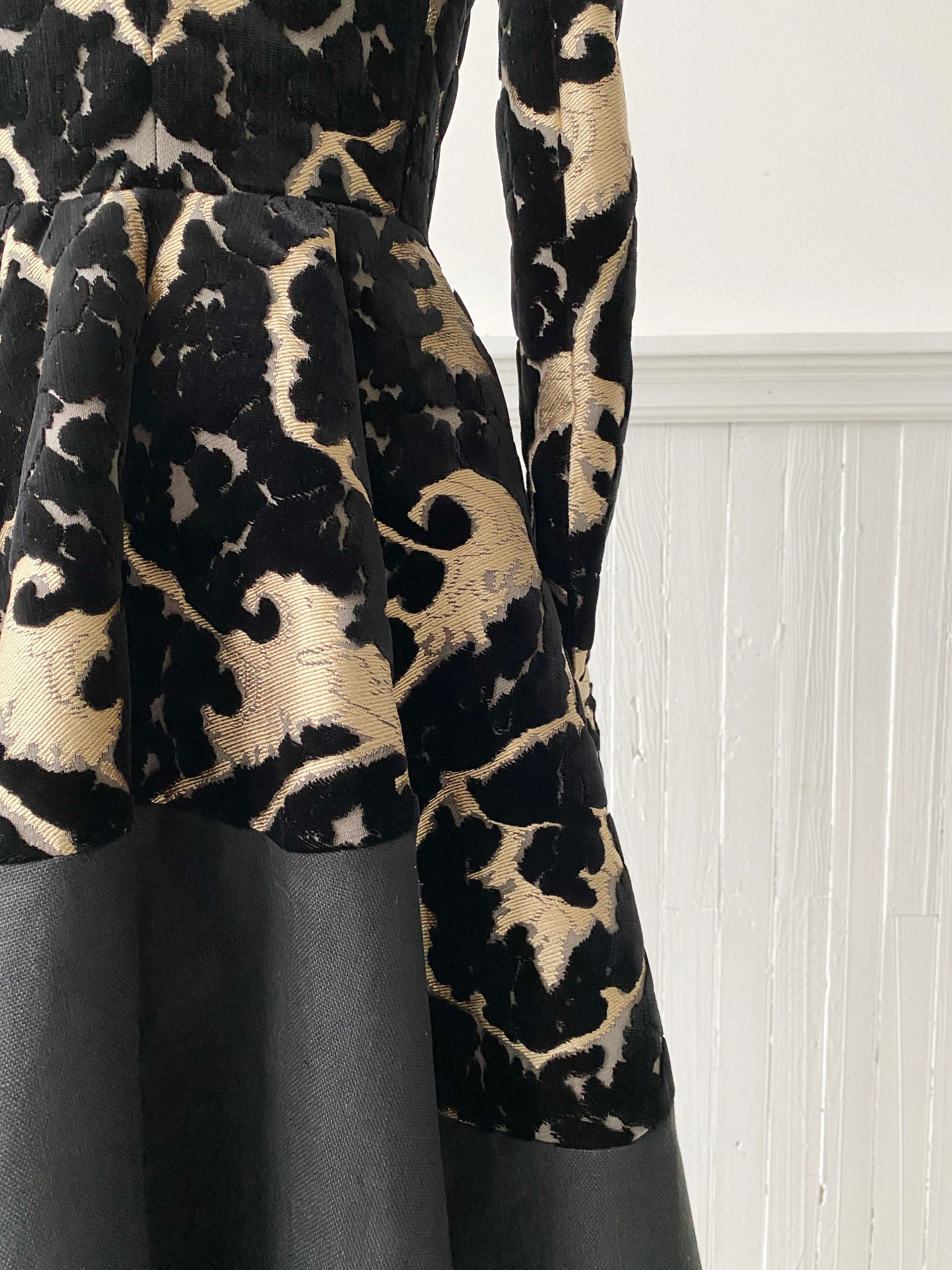muse of capitalism coat