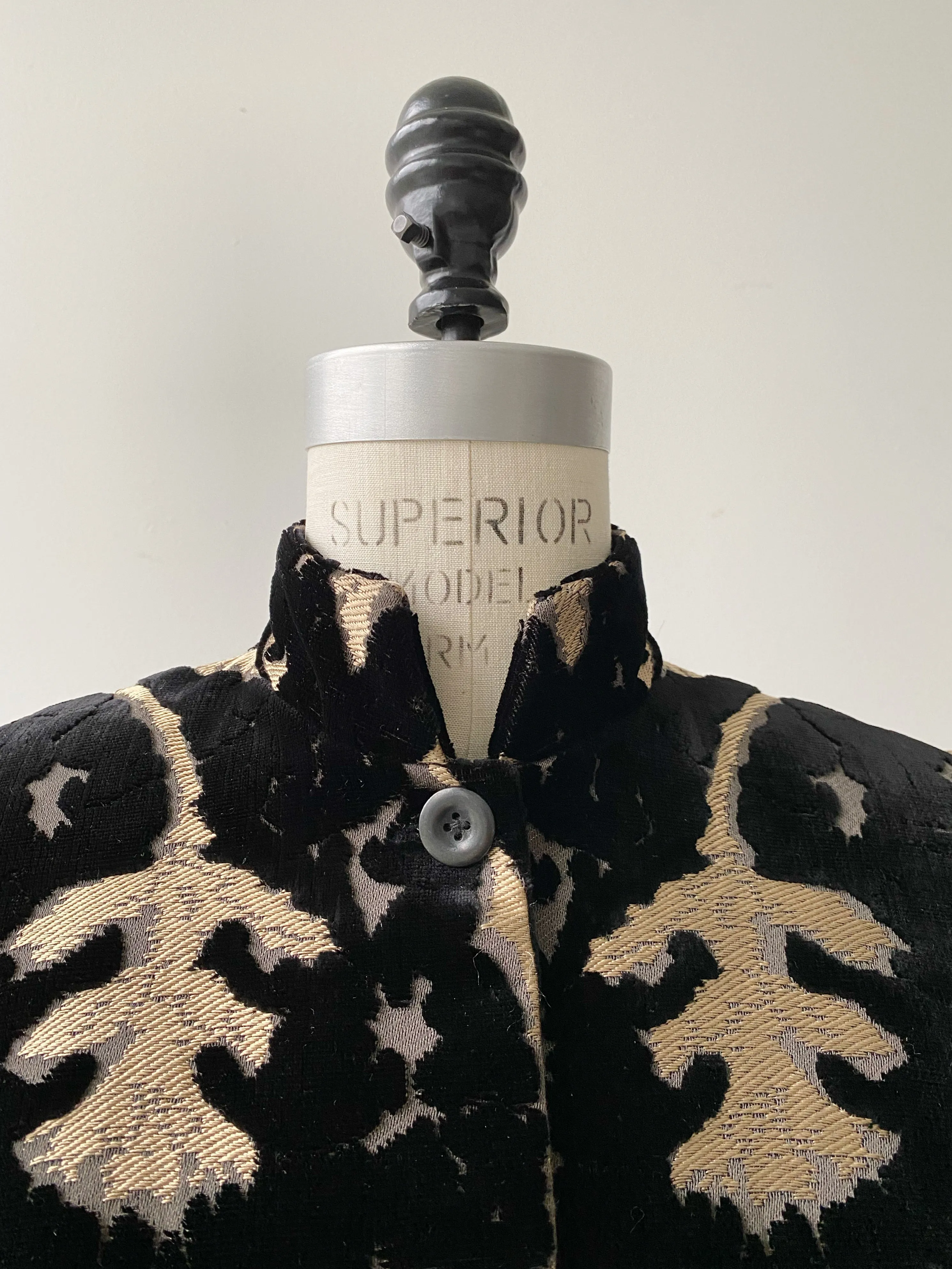 muse of capitalism coat