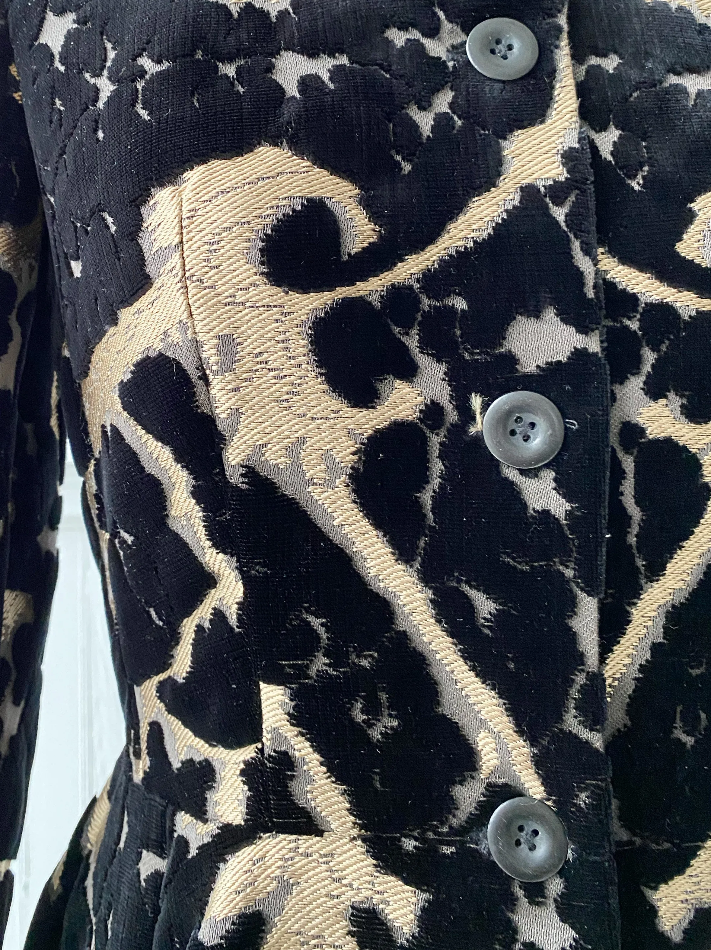 muse of capitalism coat