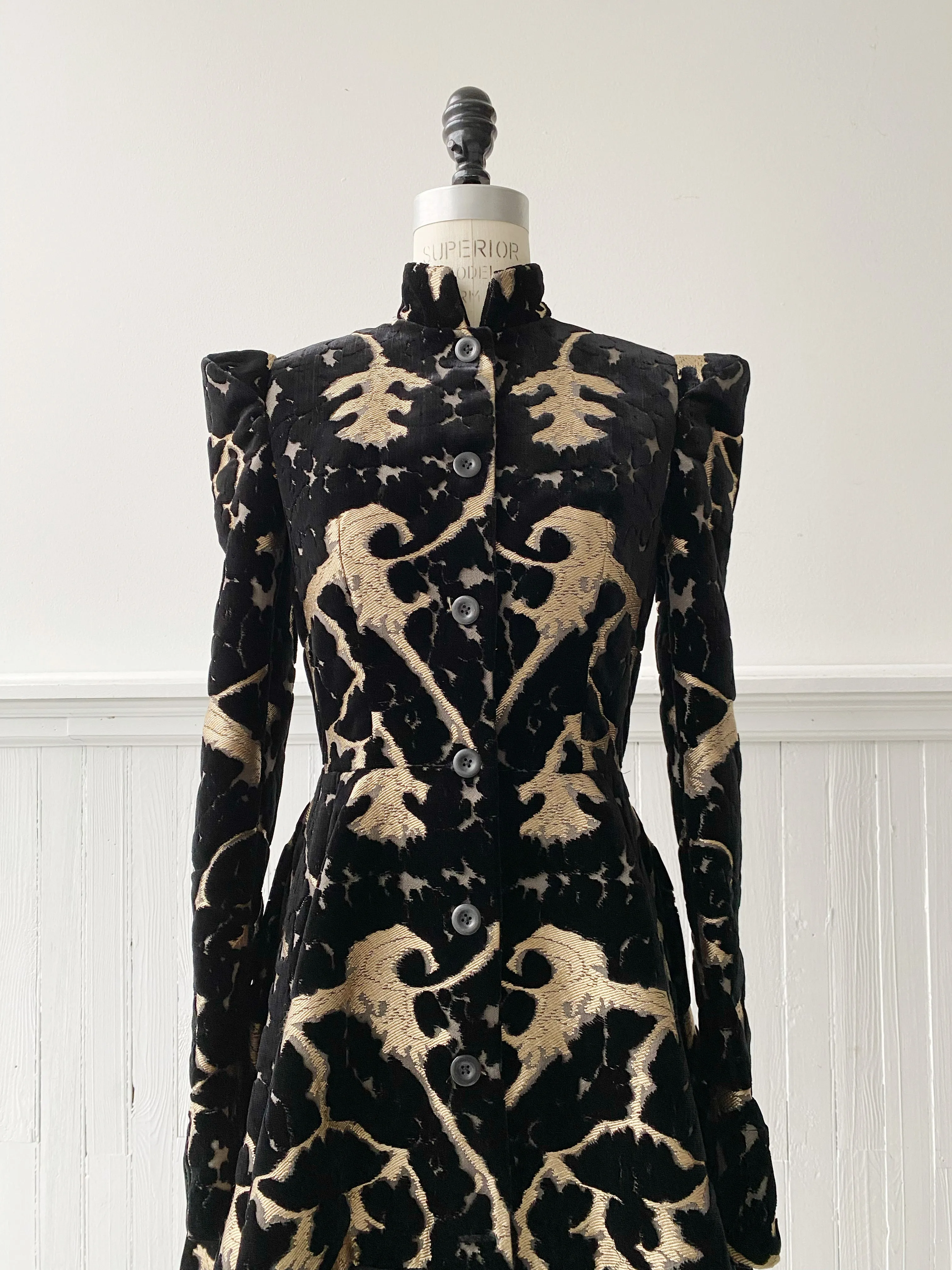 muse of capitalism coat